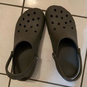 Men’s size 10, women’s size 12 dark grey crocs